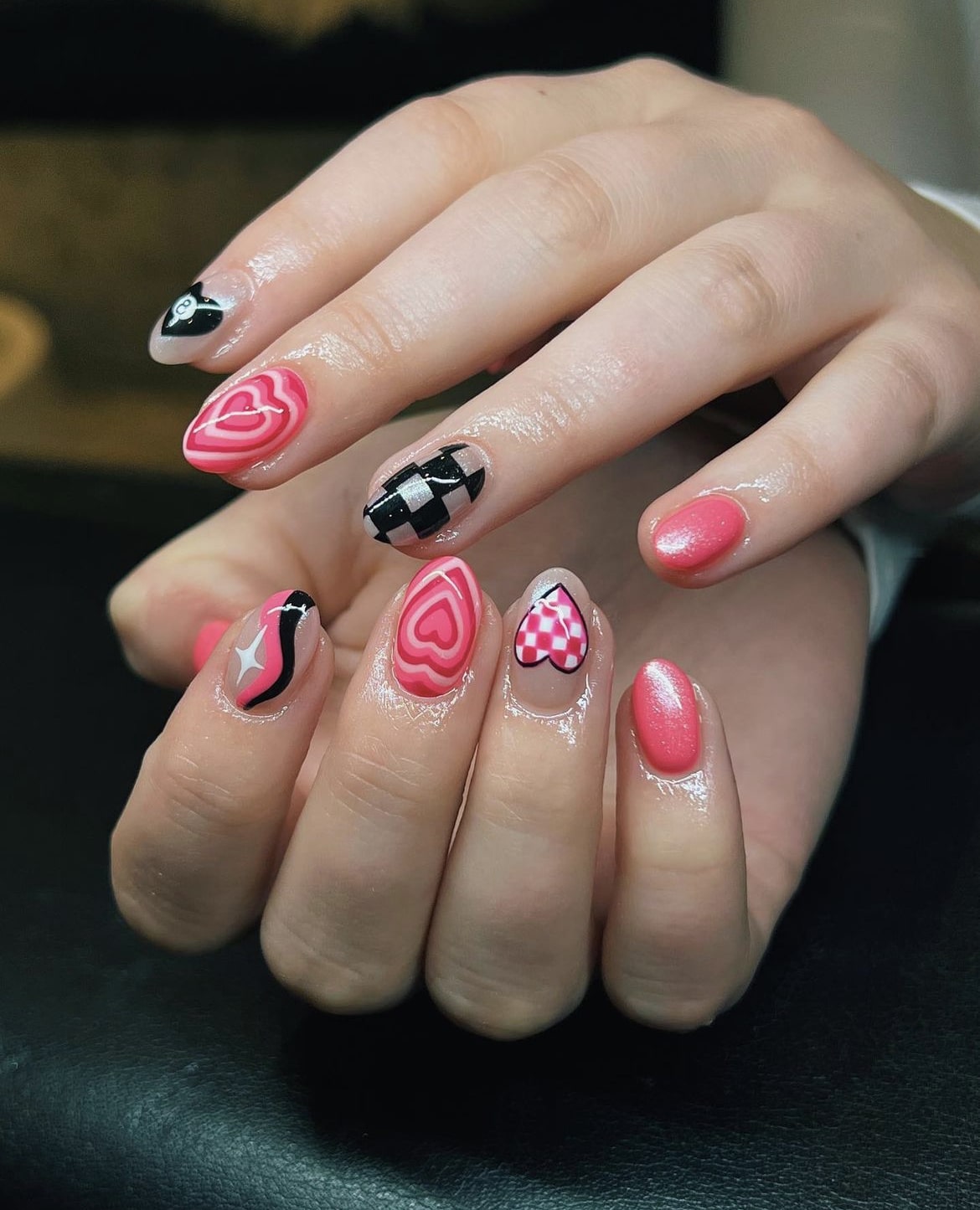 Artistic Pink and Black Nail Design